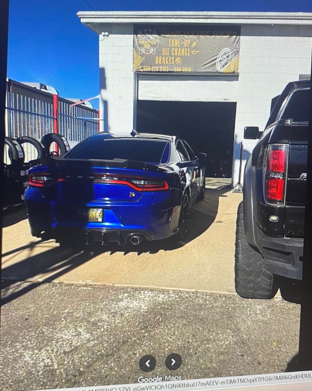 Blue Dodge Charger getting service at the shop